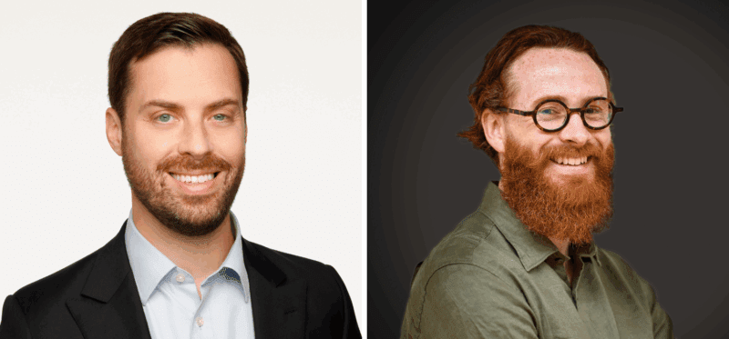 Side-by-side portraits of two men: one with short dark hair and a beard, wearing a suit and light blue shirt; the other with long red hair, a full red beard, round glasses, and a green shirt, smiling against a dark background.